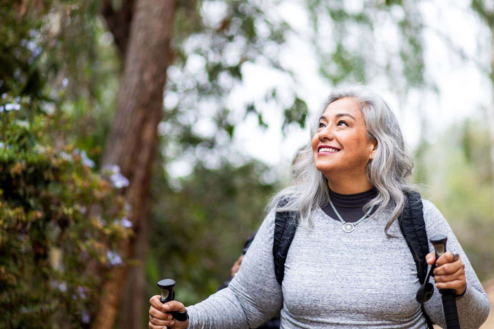a woman enjoying a hike in the forest