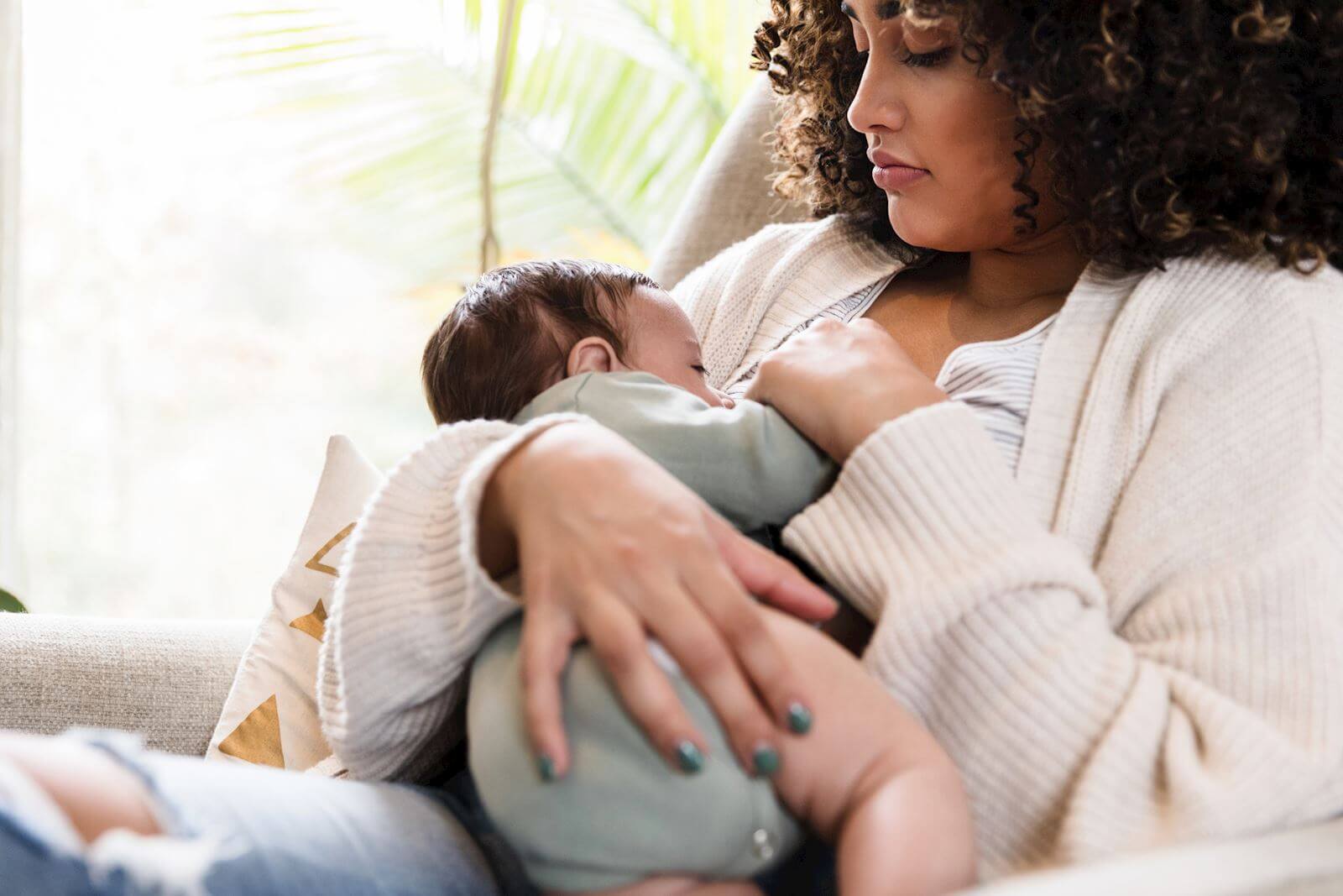 woman breastfeeding baby