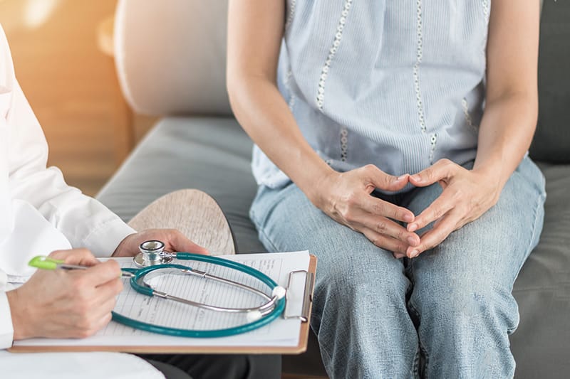 woman reviewing medical information with doctor