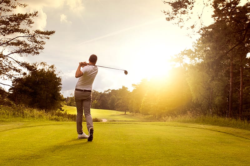 guy on the golf course after a swing