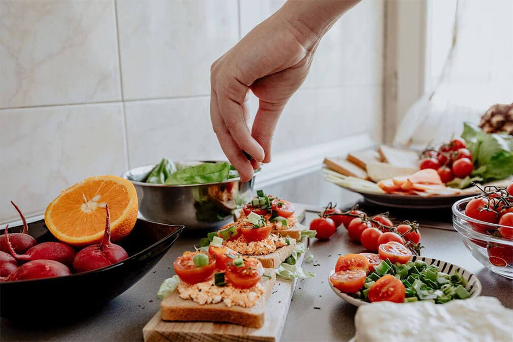 hand creating heart healthy foods