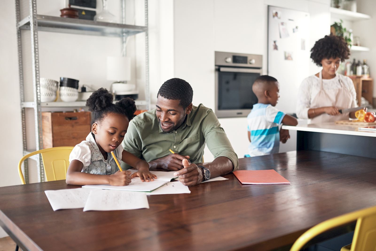 dad helping his daughter with homework