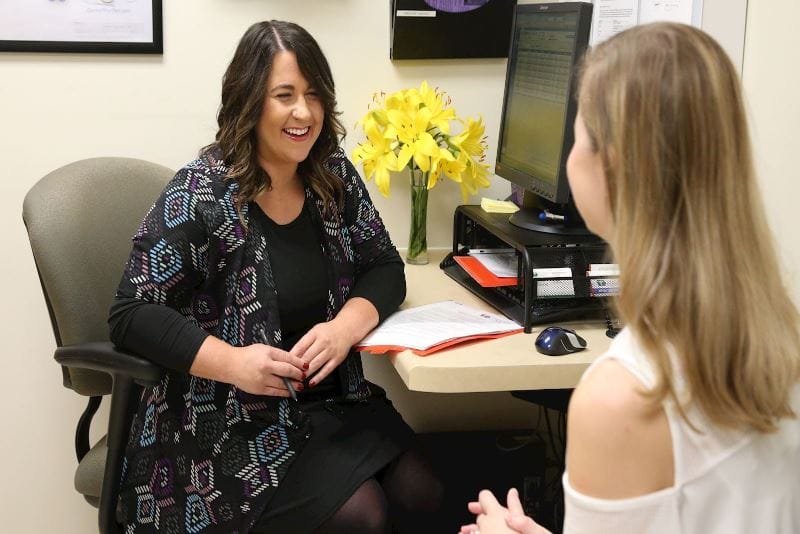 woman discussing medication with patient