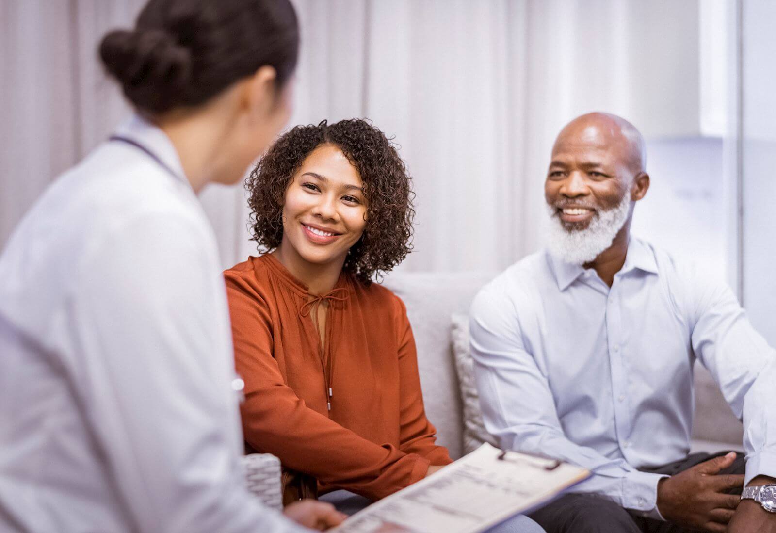 provider meets with man and woman