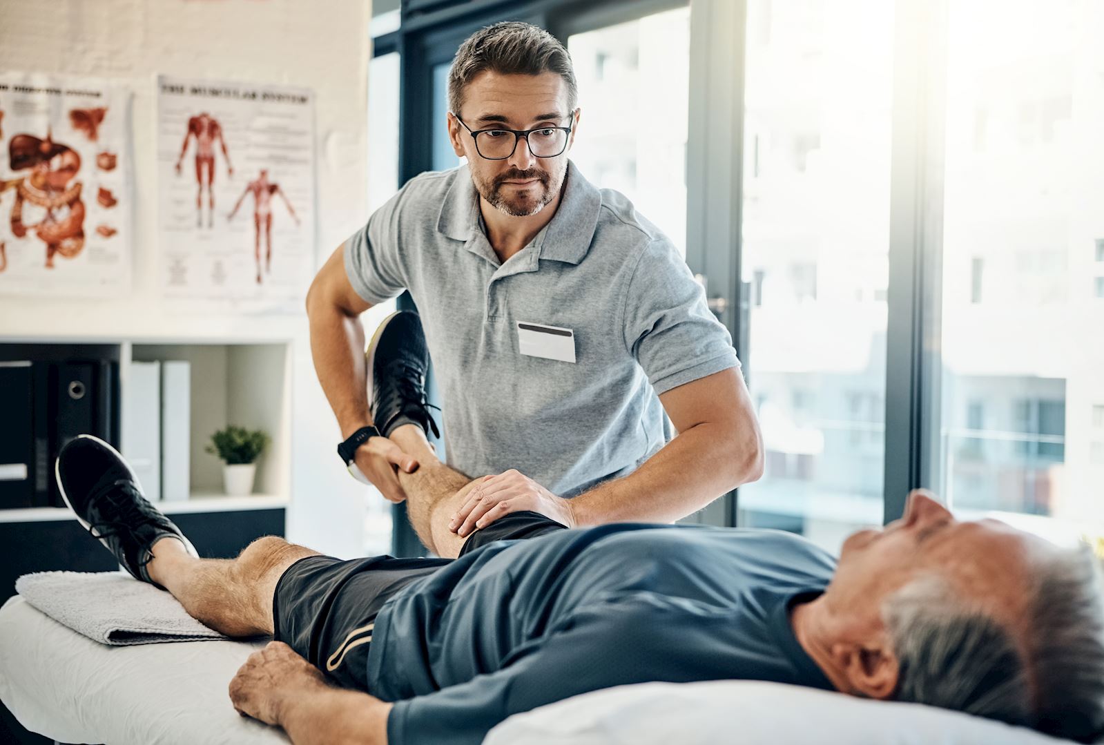 physical therapist working with patient