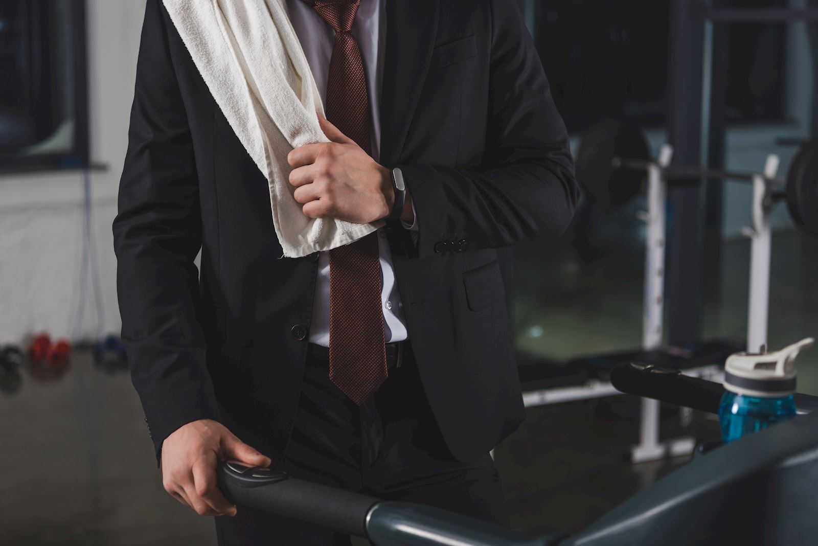 man in suit walking on treadmill