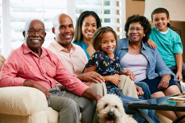 family sits on a couch