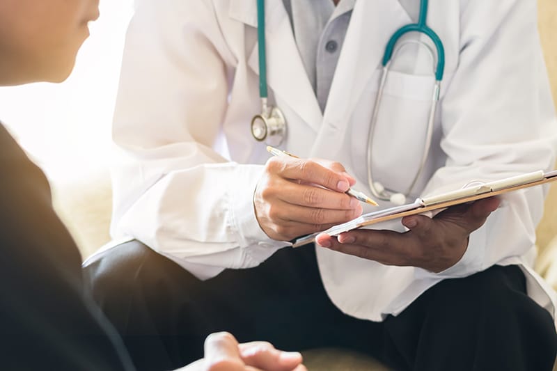 person talking with their doctor
