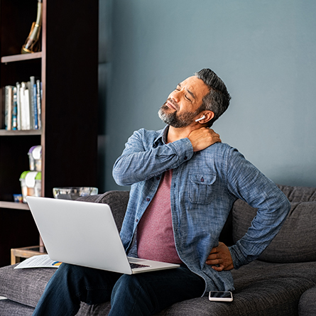 Man holding his neck in pain