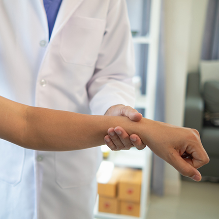 Doctor holding a patients wrist