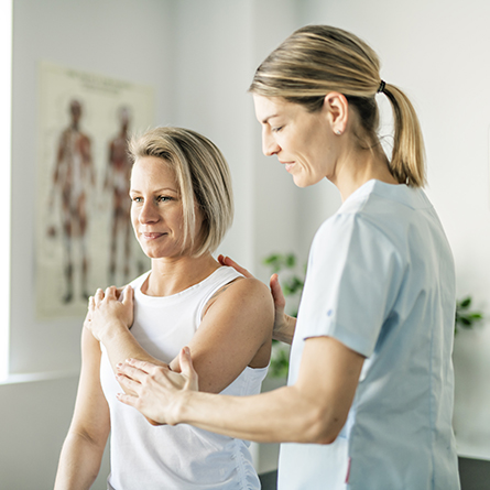 Physical Therapist working on a patients elbow