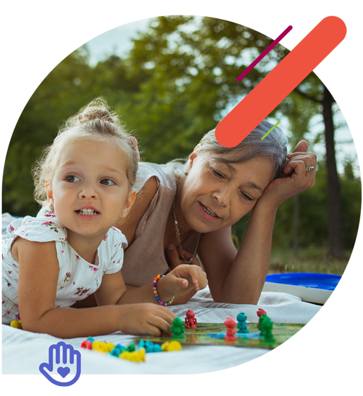 Grandmother and granddaughter playing a game outside