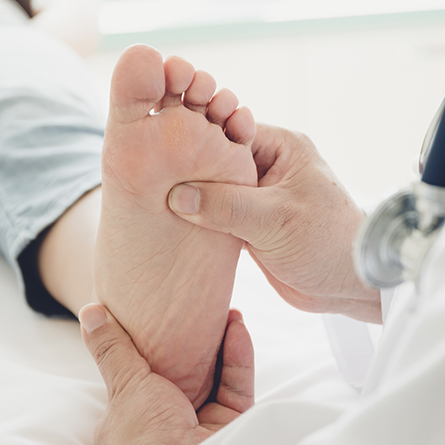 Doctor checking a patients foot