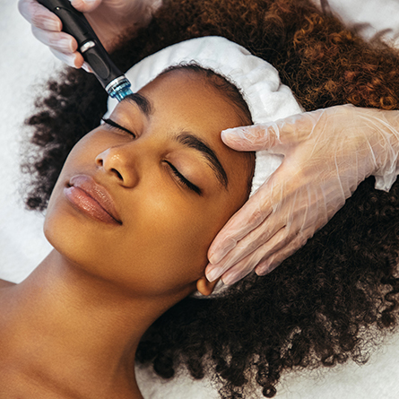 woman receives dermatology procedure
