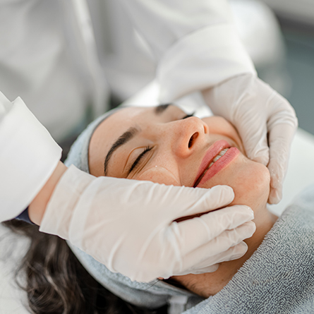 woman receives facial treatment
