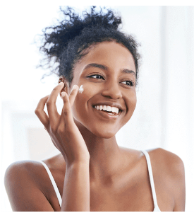 Female applying face cream