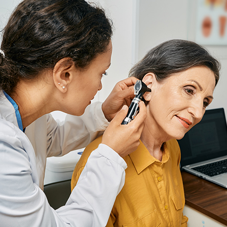 Doctor checking a patients ear