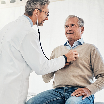 Cardiologist checking mans heart