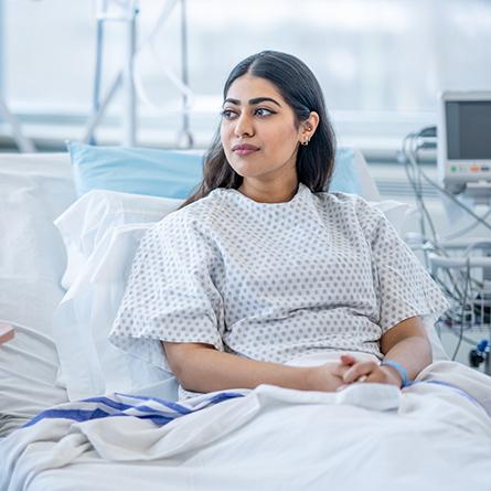 Patient sitting up in a hospital bed