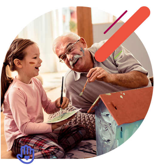 Grandfather and granddaughter painting together