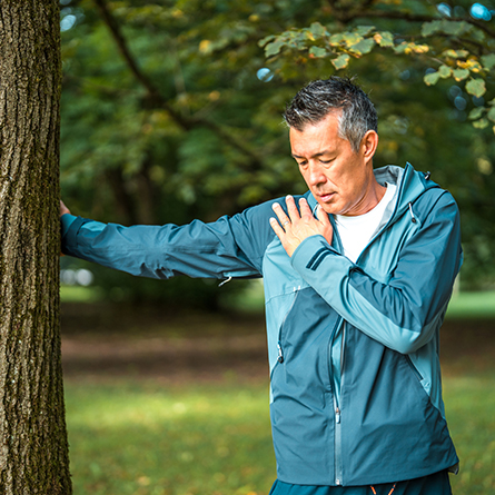 Man stretching his arm and shoulder