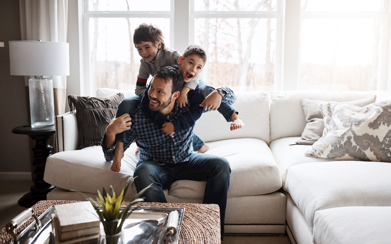 father playing with his children