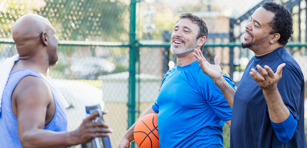 Group of men playing basketball