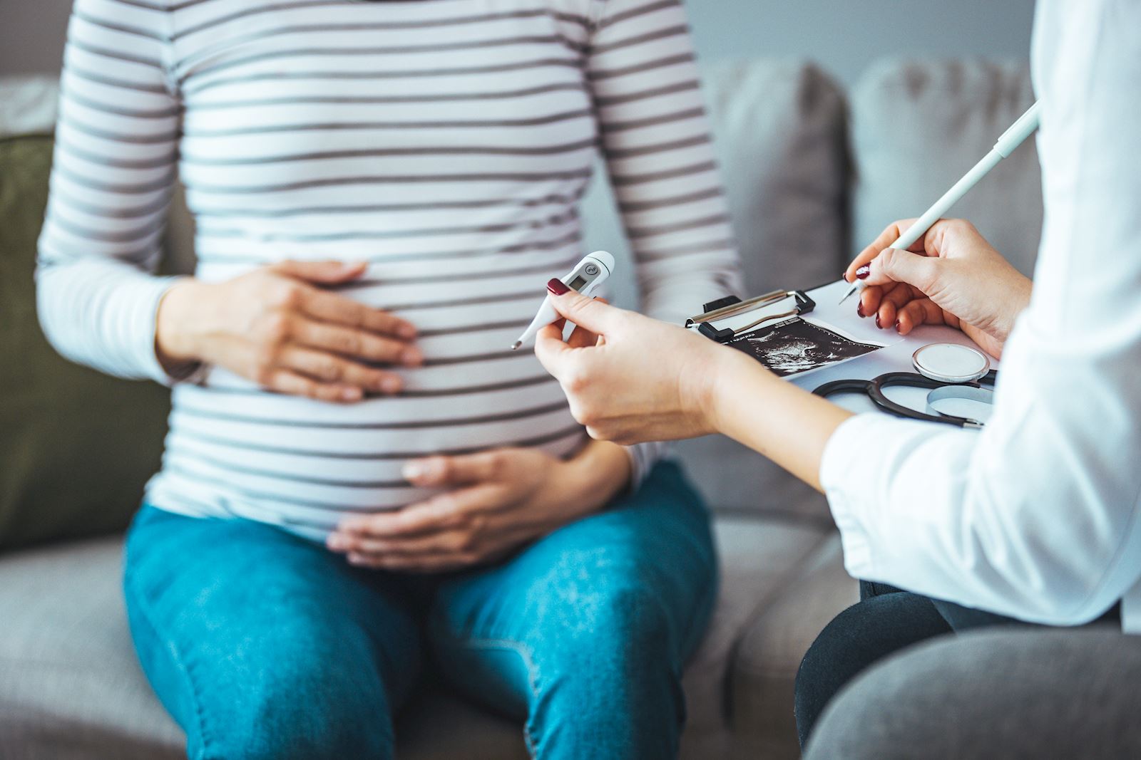 Pregnant woman with healthcare provider