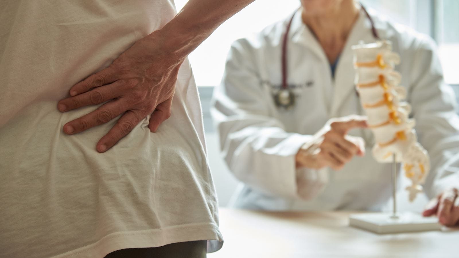 Man holding his back in pain