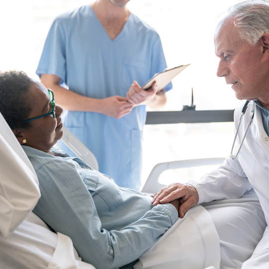 Doctor consulting patient after surgery